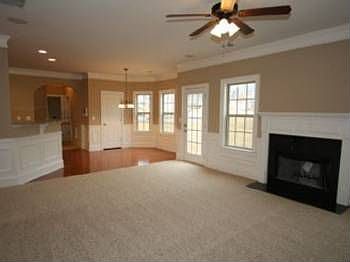 OPEN SPACIOUS FAMILY ROOM VIEW TO KITCHEN