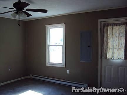 Living Room : Baseboard heat, ceiling fan, replacement windows, carpeted