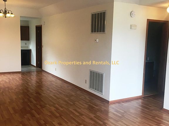 Living/ Dining room facing hall bath and 2nd bedroom