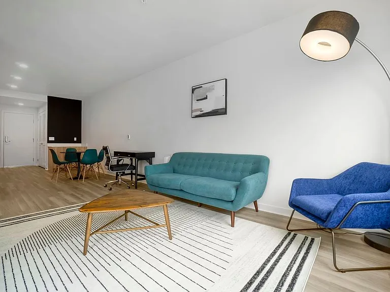Furnished+ apartment homes come outfitted with a sofa, side chair, side table, coffee table, TV stand and 50" Television (Representative Image exact items and style of furnishings may vary)