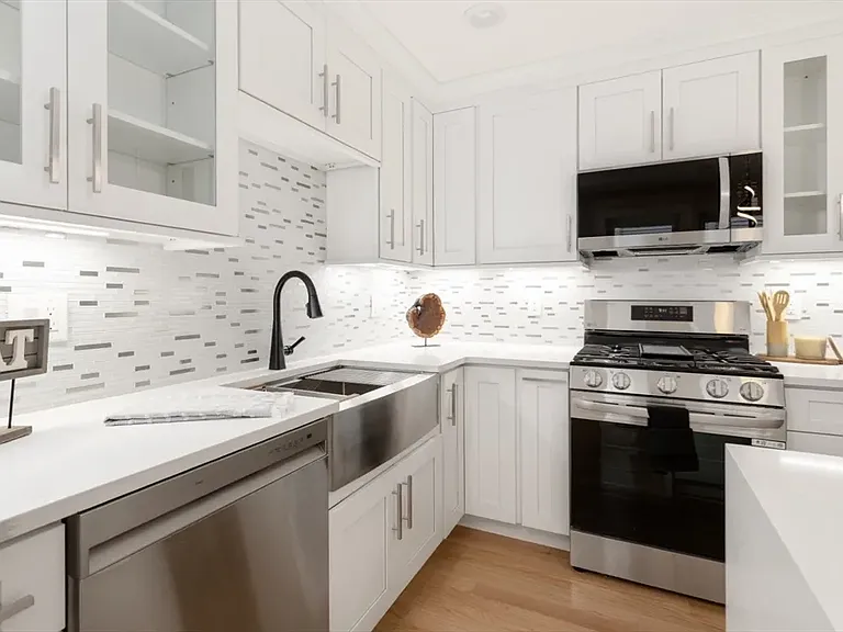 Gourmet chef's kitchen with brand-new stainless appliances and custom cabinetry.