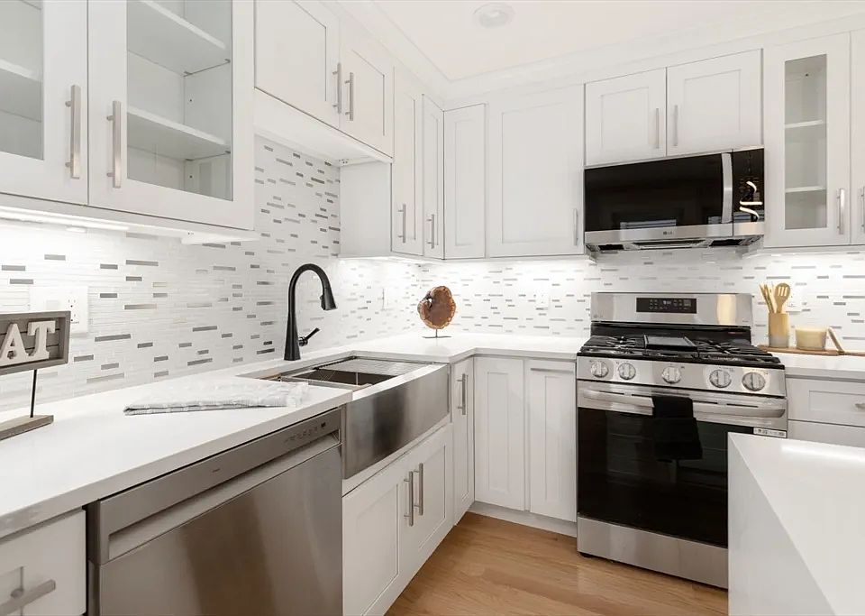 Gourmet chef's kitchen with brand-new stainless appliances and custom cabinetry.