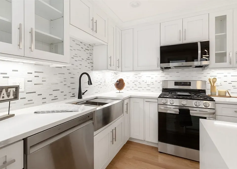 Gourmet chef's kitchen with brand-new stainless appliances and custom cabinetry.