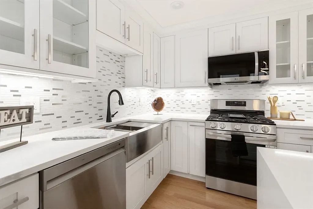 Gourmet chef's kitchen with brand-new stainless appliances and custom cabinetry. - 157 Boston Ave