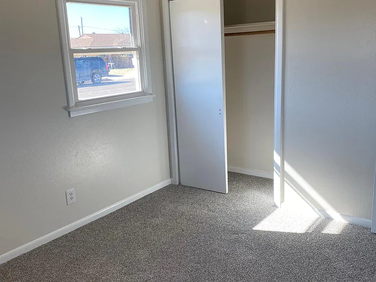 3rd bedroom. Features brand new carpet, natural light, large closet, and custom paint.
