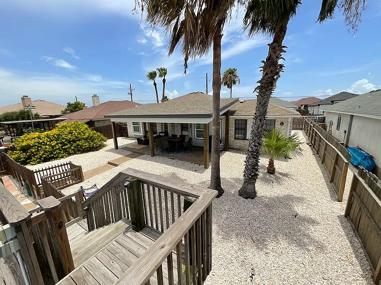 View of back patio/yard from upper deck