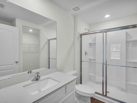 The master bathroom has a large walk in shower