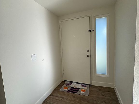 Entryway and Front Door leads to Living Room, Dining Room and Kitchen in one direction then the hallway to the bedrooms in the opposite direction.