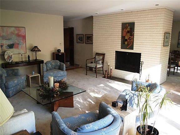 Living room with wood-burning fireplace