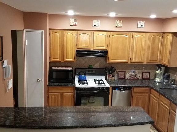 Kitchen with breakfast bar overlooking dining room