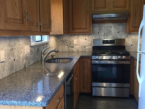 Kitchen with quartz counters, marble backsplash, all new appliances (new fridge on order)