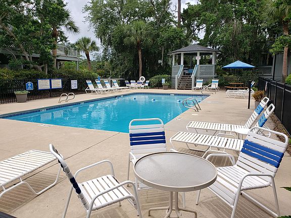 Well maintained pool with a gazebo