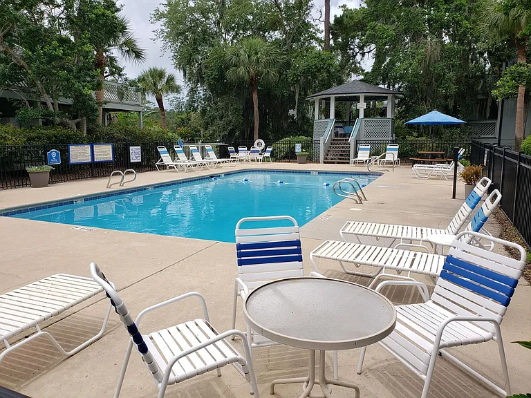 Well maintained pool with a gazebo