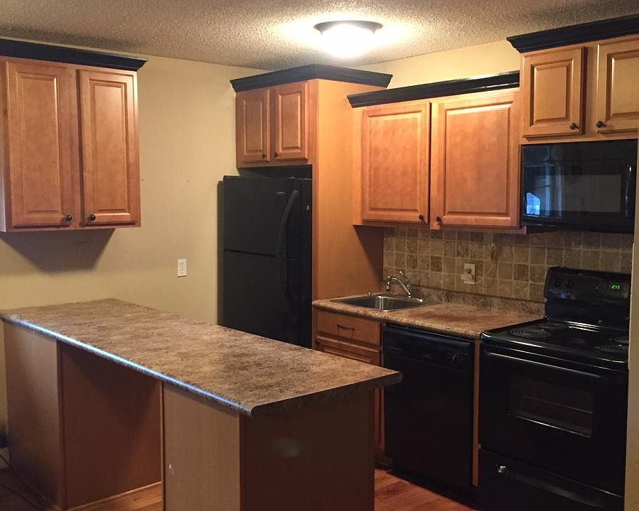 Designer kitchen with tile backsplash & built-in microwave.