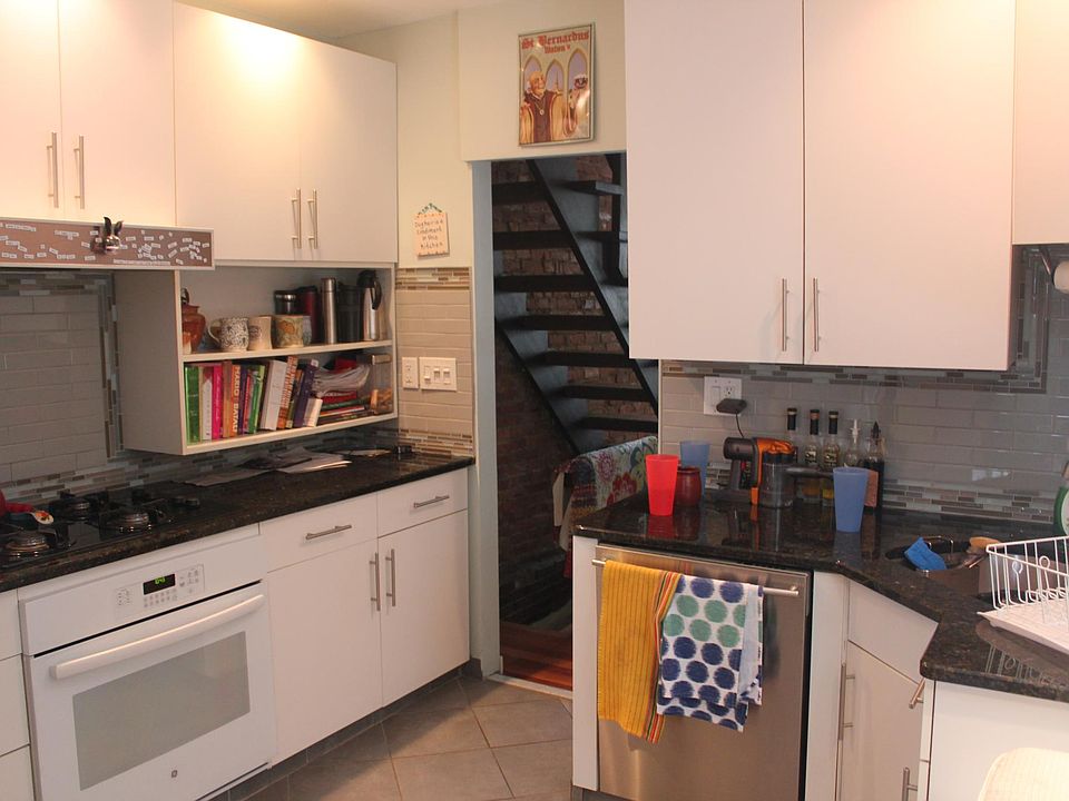 kitchen , with view of floating stairs to 2nd floor
