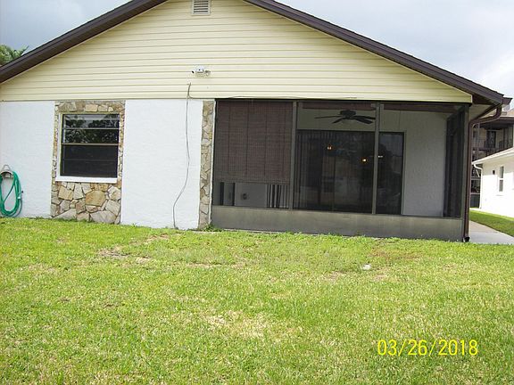 back yard looking at screen room