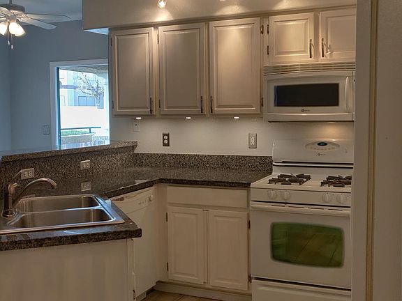 Granite counter top, stainless steel sink, decorator cabinet pulls