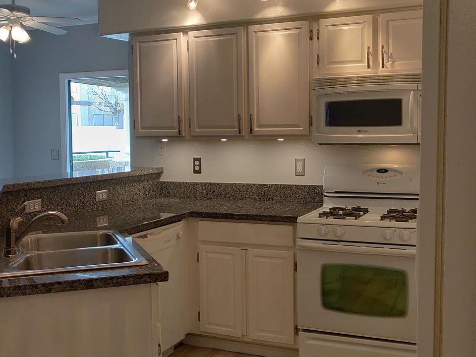 Granite counter top, stainless steel sink, decorator cabinet pulls