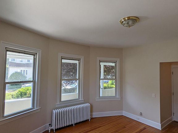 Bright bay windows light up the 1st floor living room