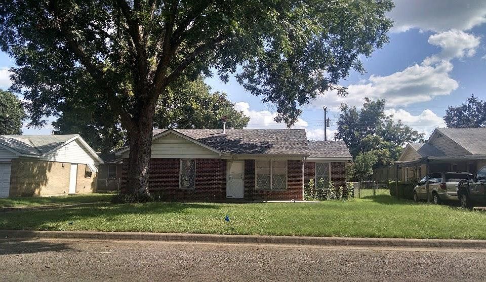 Front of the house with pecan tree