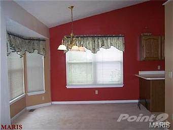 Breakfast room with vaulted ceiling
