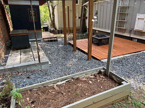 Rear yard garden beds and grilling area