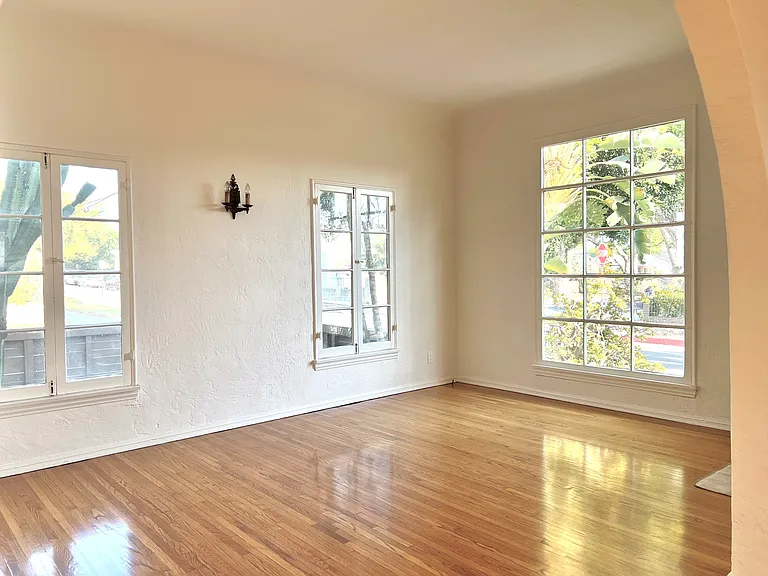 Gorgeous living room with large windows and beautiful natural light.