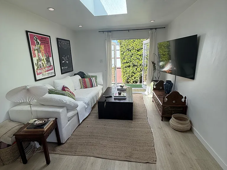 Great room looking towards French doors and private yard with all new light floors