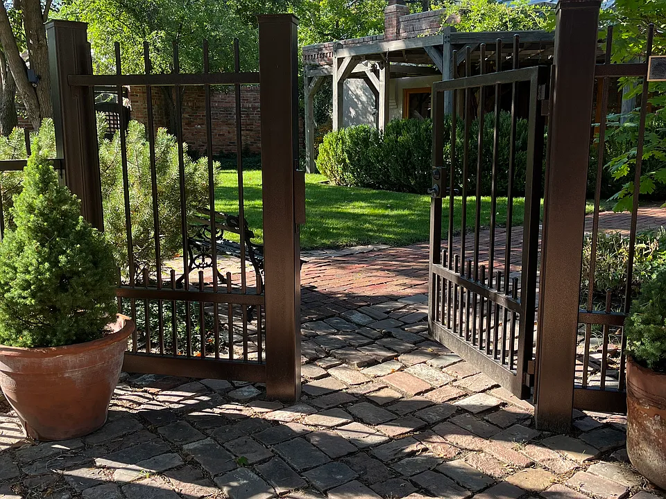 Pedestrian Entry Gate along cobblestone entry.