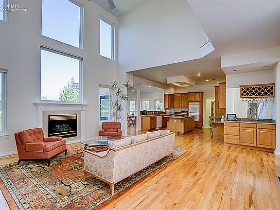 Living room with hardwood flooring and wet bar! Oh and did I mention the views?