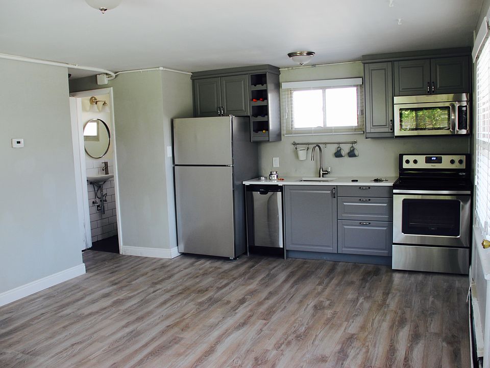 Functional modern kitchen with SS appliances.