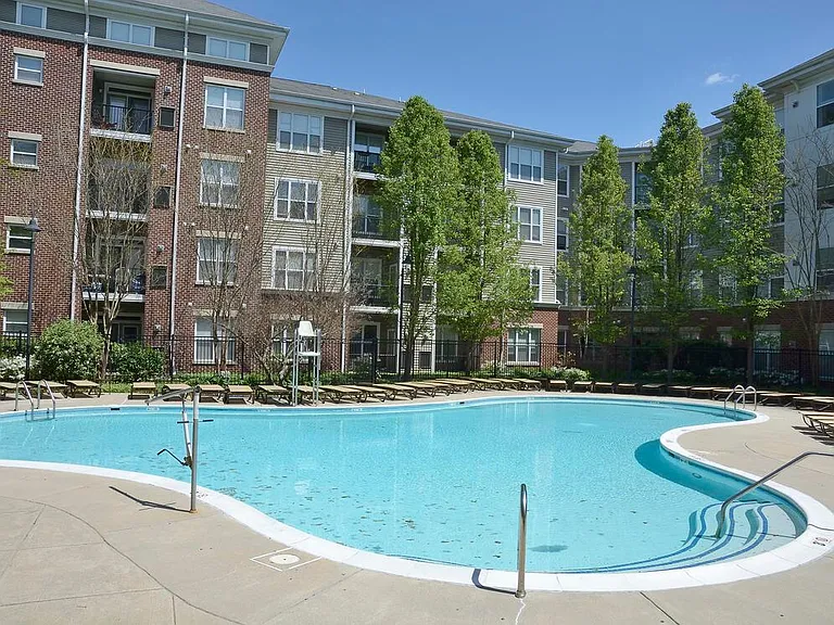 Swimming pool and sundeck with lounge seating