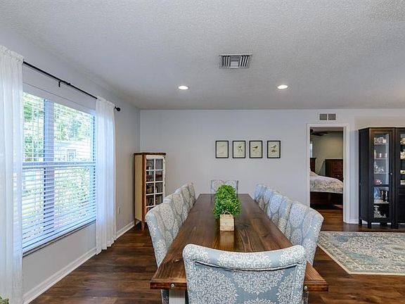 This Family is Utilizing the Front Living Room (16.5' x 11.5') for their 10-Person Custom Dining Table!