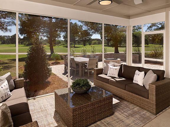 Screened Porch right off the gathering room is perfect for seamless entertaining.- Model Representat