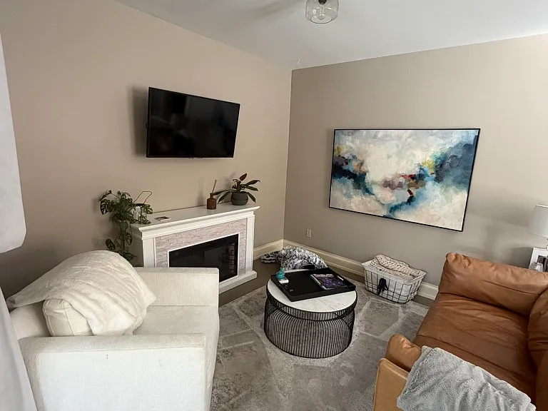 front room with an electric fireplace (not included)