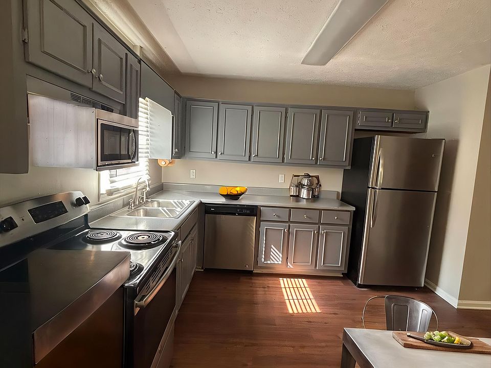 Step into the inviting kitchen of Guest House, featuring modern stainless steel appliances and spacious countertops ideal for culinary adventures. Enjoy the warmth of natural light that enhances the welcoming atmosphere. Schedule your visit today!