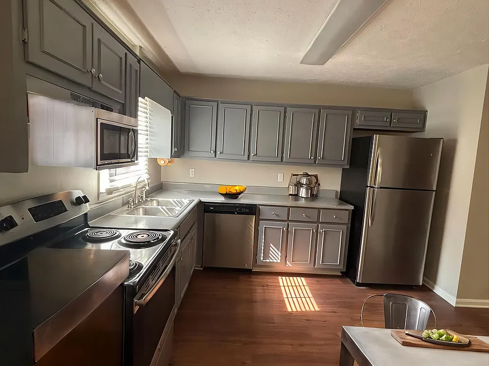 Step into the inviting kitchen of Guest House, featuring modern stainless steel appliances and spacious countertops ideal for culinary adventures. Enjoy the warmth of natural light that enhances the welcoming atmosphere. Schedule your visit today!