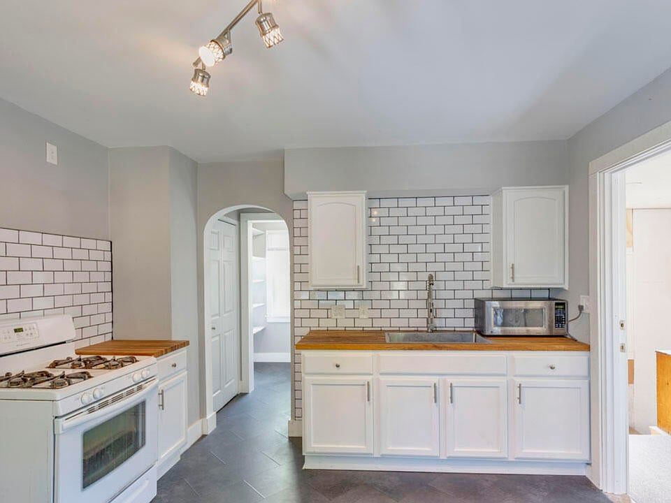 Large dining kitchen, with pantry and an extra storage area.