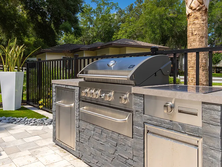 Fire up a delicious BBQ at our outdoor kitchen, boasting a stately gas grill for cookout fiestas.