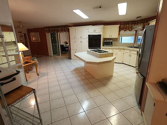 Kitchen in center of home