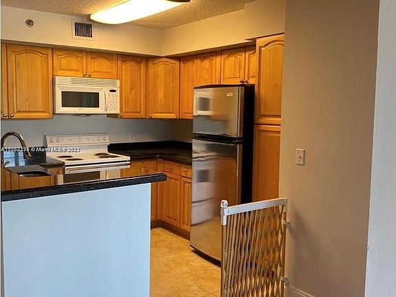 2nd image of 19601 E Country Club Dr #7403