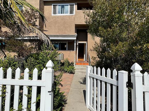 Entrance to gated yard and front door.