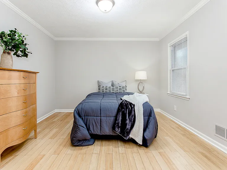 Room 4. Double bed, closet, dresser, nightstand, lamp.