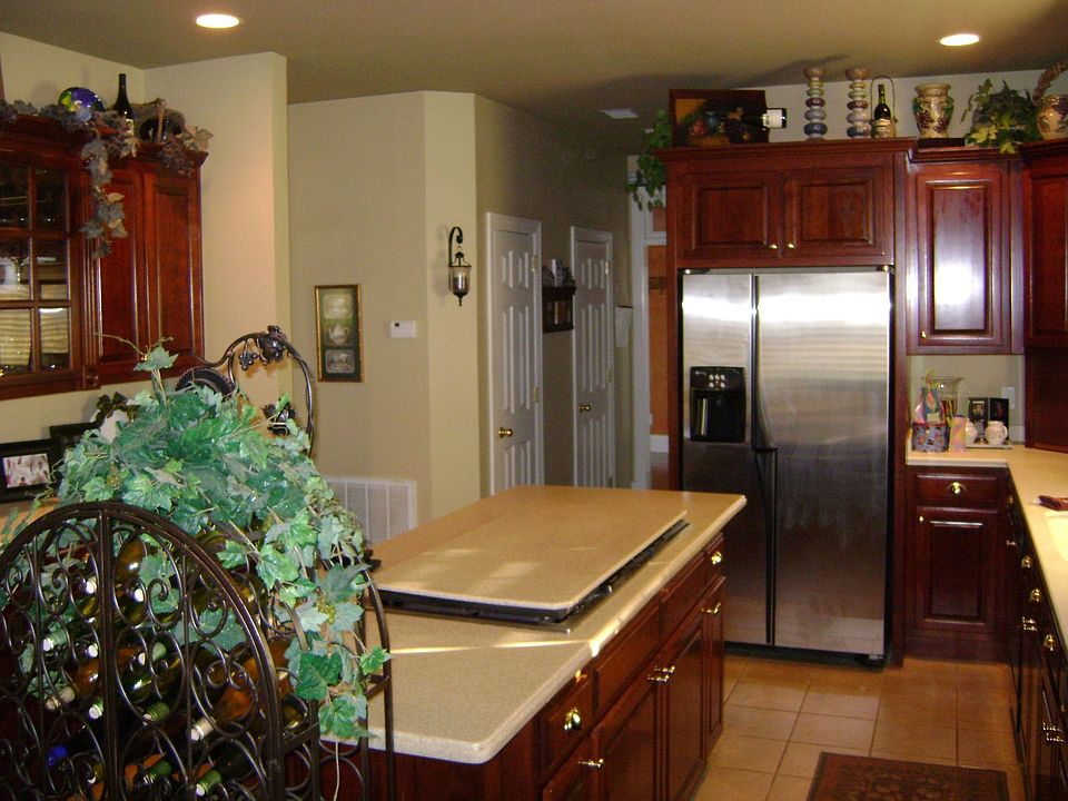 The kitchen features and abundance of beautiful cabintry with a cooking island