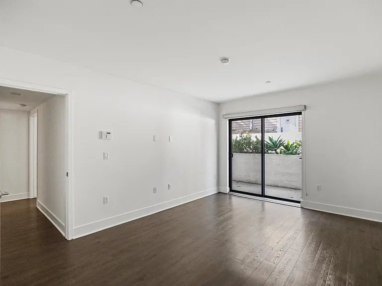 Spacious Bedroom with Vinyl Flooring and Patio