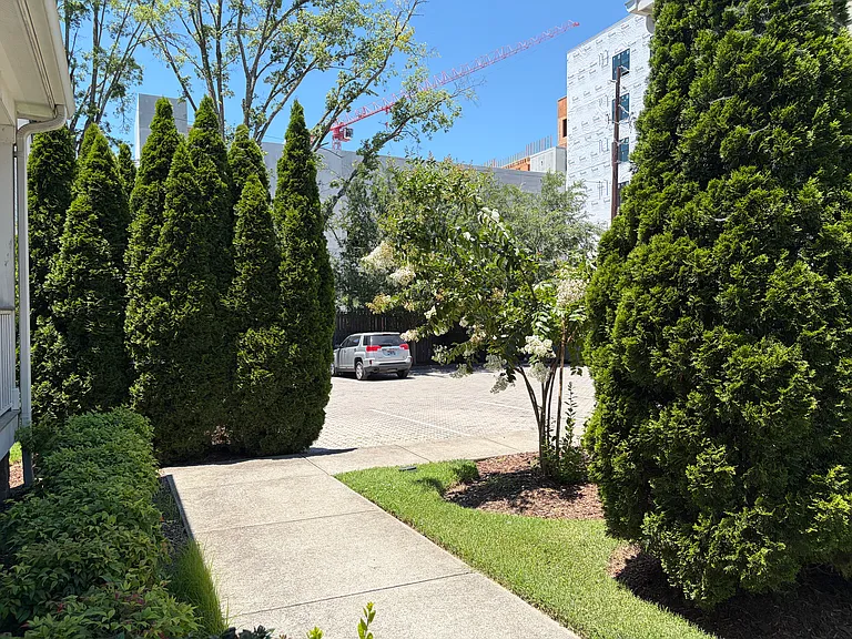 This home comes with something rare - private PARKING! Parking can be hard in the Nations due to the many attractions, so having a private parking lot for the 9 homes in the HOA is a real bonus.