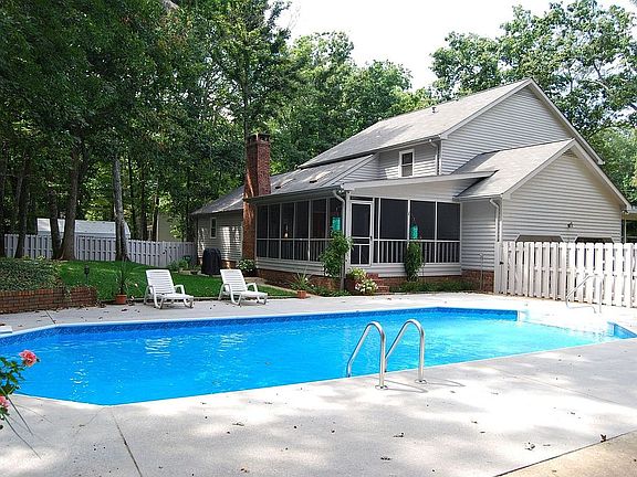 Large fenced-in backyard with heated pool.