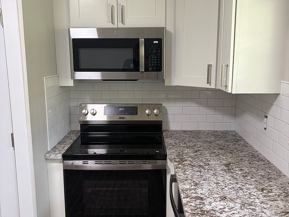 STANDING IN FRONT OF KITCHEN SINK LOOKING LEFT TOWARD STOVE