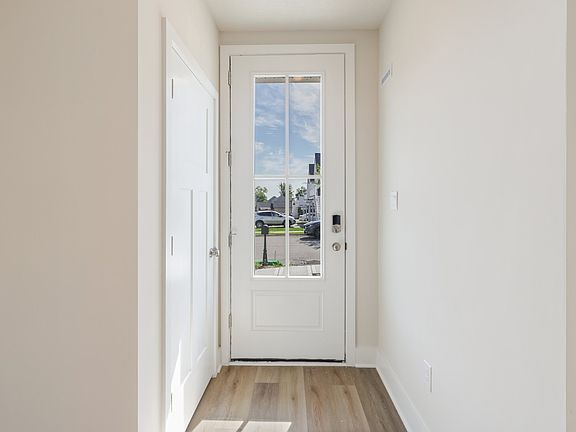 Main entry foyer of End Unit Townhome with Luxury Vinyl Plank flooring