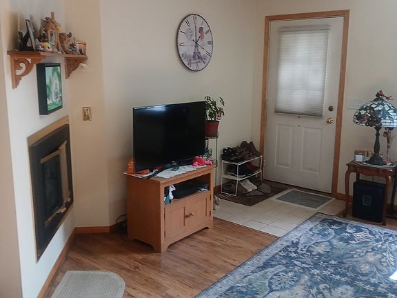Gas fireplae and front door - Sunlight streaming in through the loft window